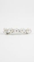 Silver ring with embedded stones on a white background Pearl & White Blossom Floral Clips