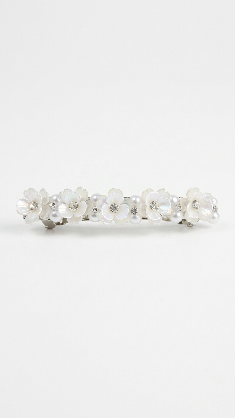Silver ring with embedded stones on a white background Pearl & White Blossom Floral Clips